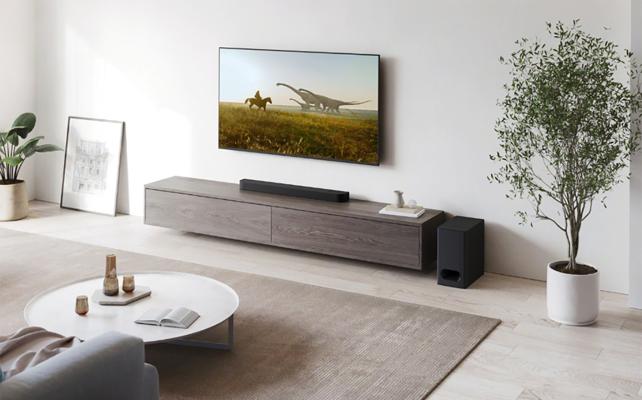 A TV with a Sony Bravia Theatre Bar 6 under it.