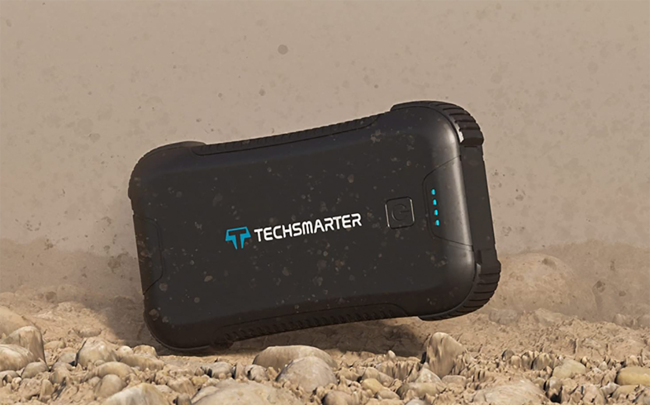 The Techsmarter rugged pwoer bank sitting on the ground.