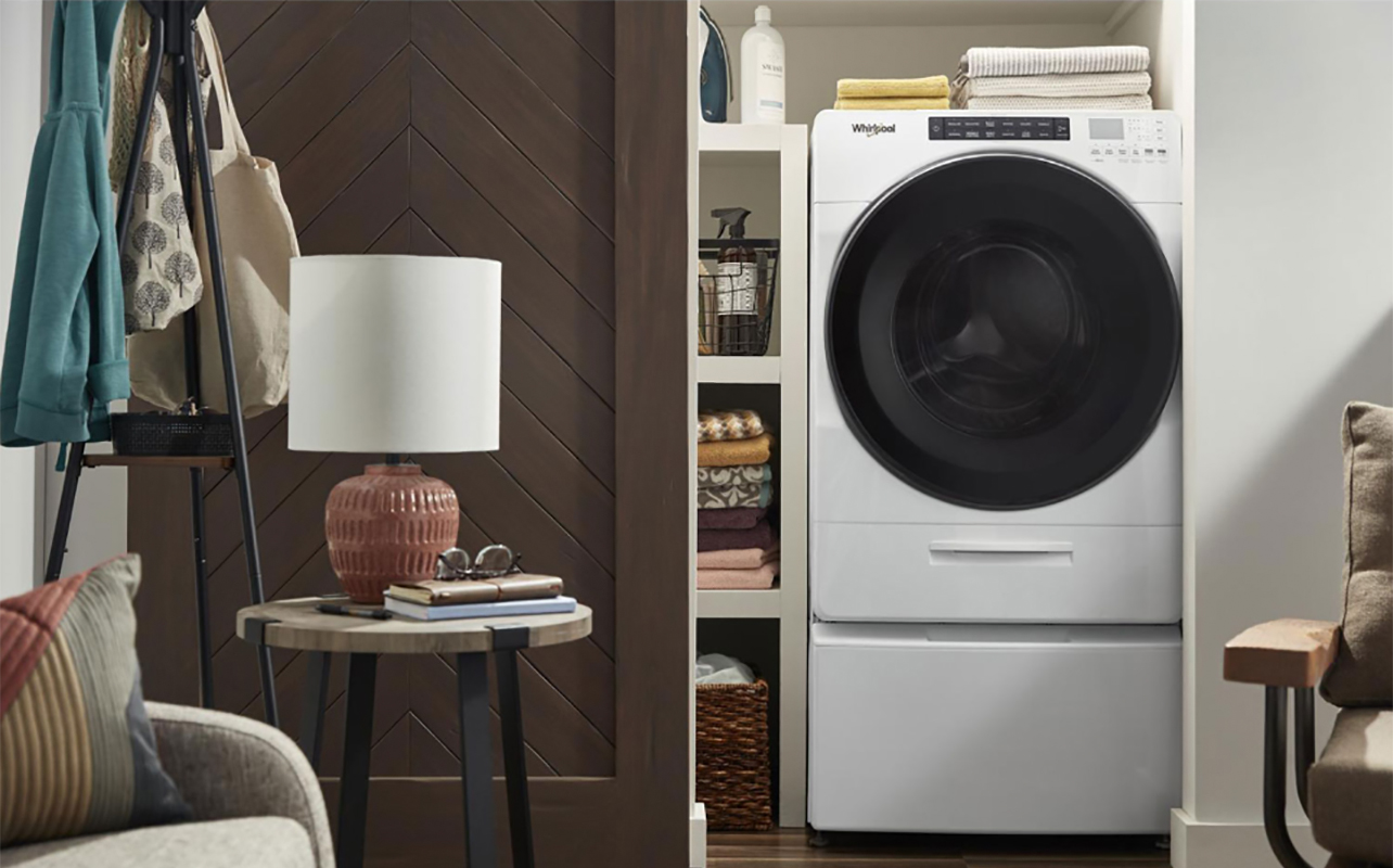 A Whirlpool washer dryer set up in a laundry area.