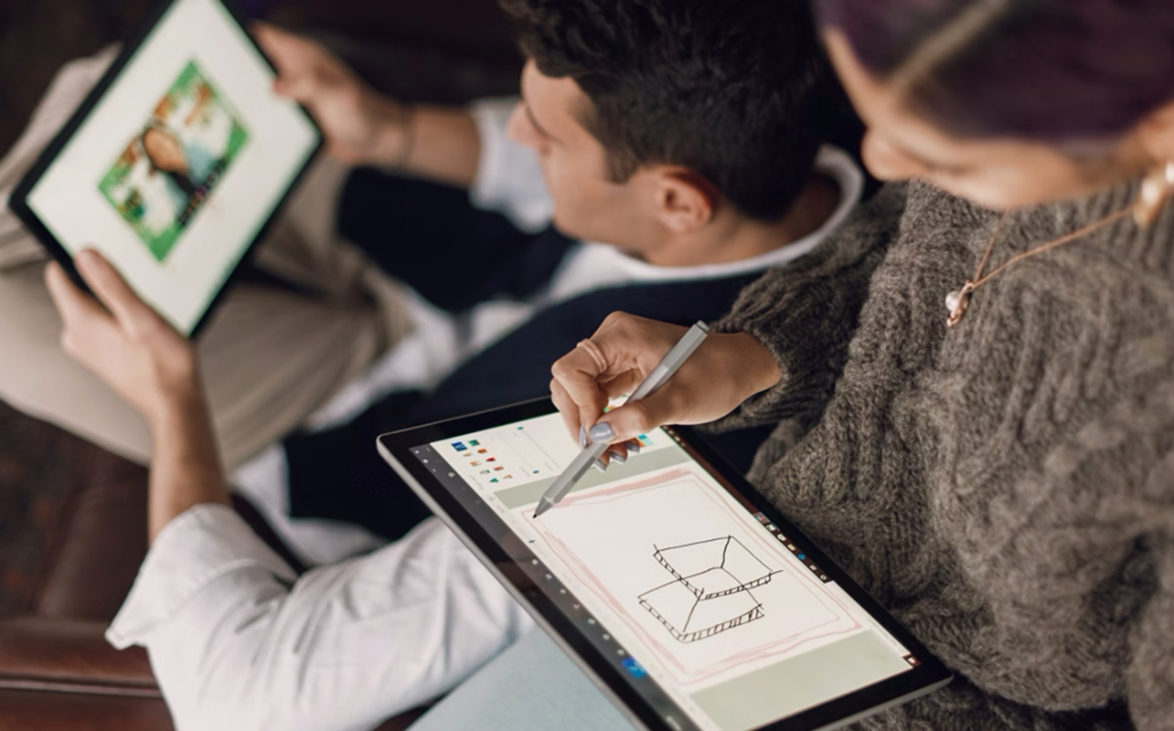 Students using 2-in-1 laptop in tablet mode.