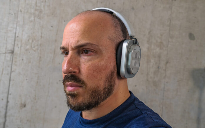 Wearing Nothing Headphone (1) indoors.