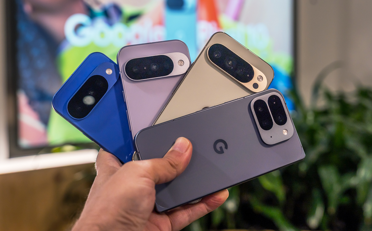 Google Pixel 10 series phones in hand fanned out.