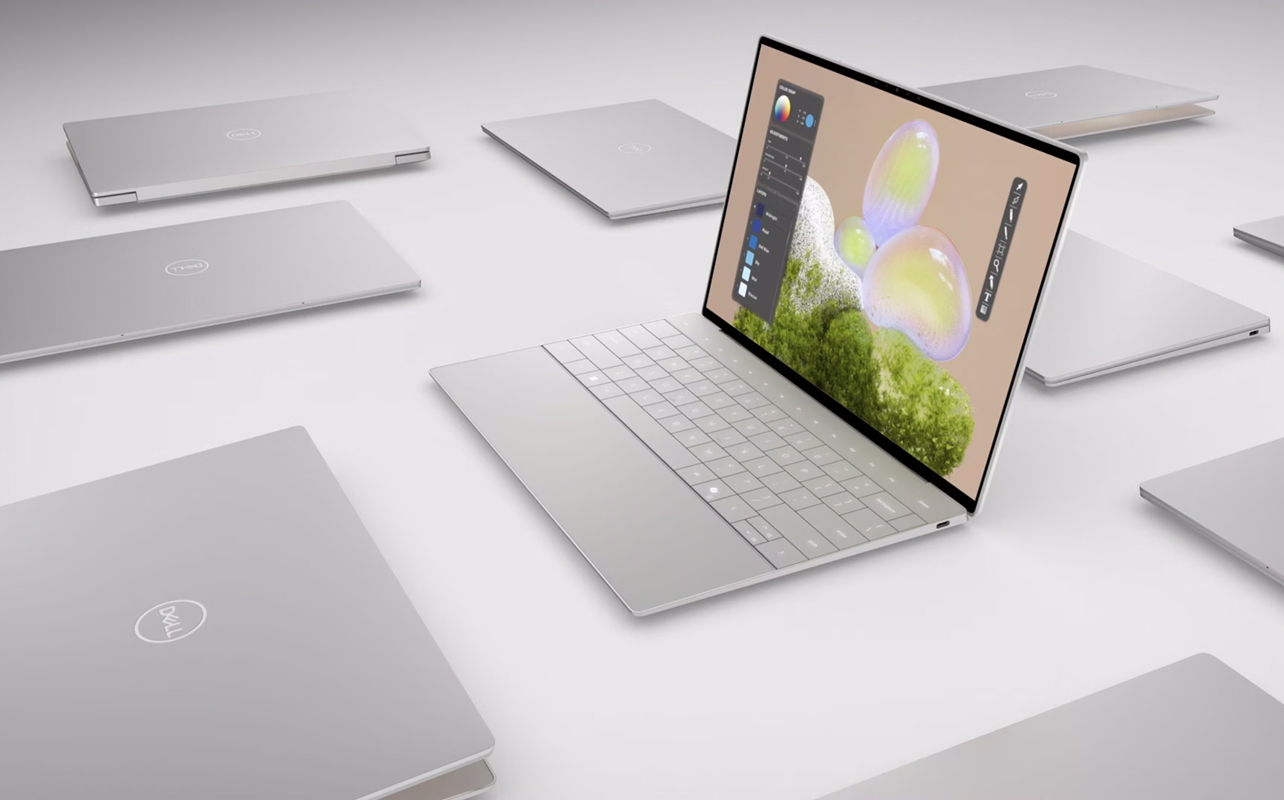 Dell XPS premium Windows laptops laid out on a white surface.
