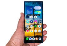 Samsung Galaxy Z Fold7 folded in hand on white background.