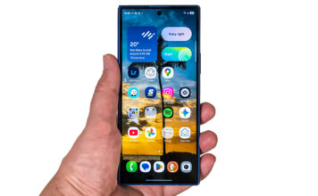 Samsung Galaxy Z Fold7 folded in hand on white background.