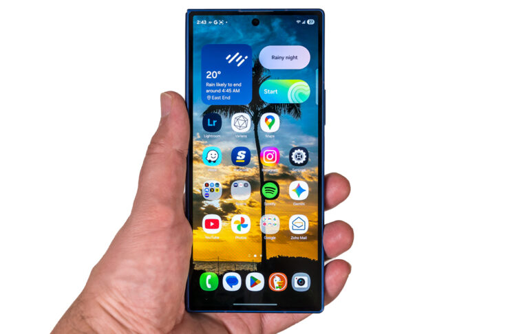 Samsung Galaxy Z Fold7 folded in hand on white background.