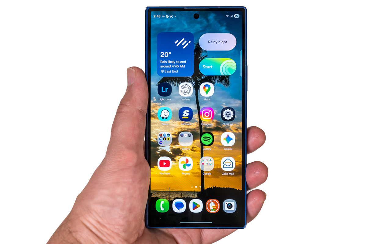 Samsung Galaxy Z Fold7 folded in hand on white background.