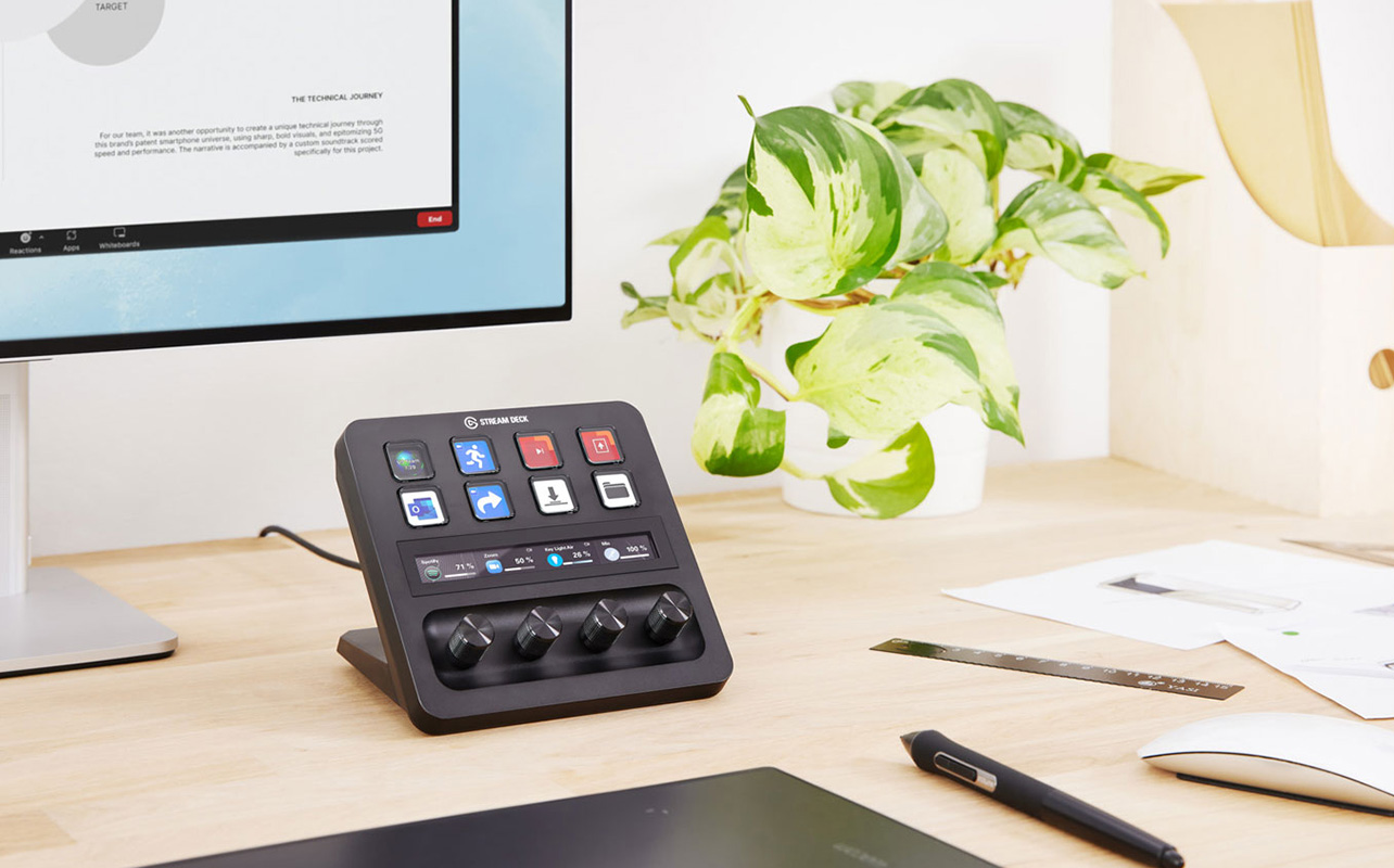 Stream Deck on desk beside monitor and plant
