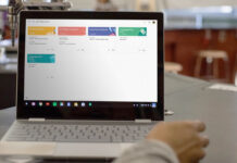 Google Classroom on a Chromebook sitting on a table in a classroom.