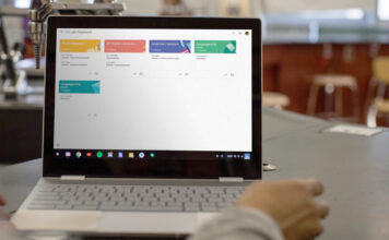 Google Classroom on a Chromebook sitting on a table in a classroom.
