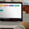 Google Classroom on a Chromebook sitting on a table in a classroom.