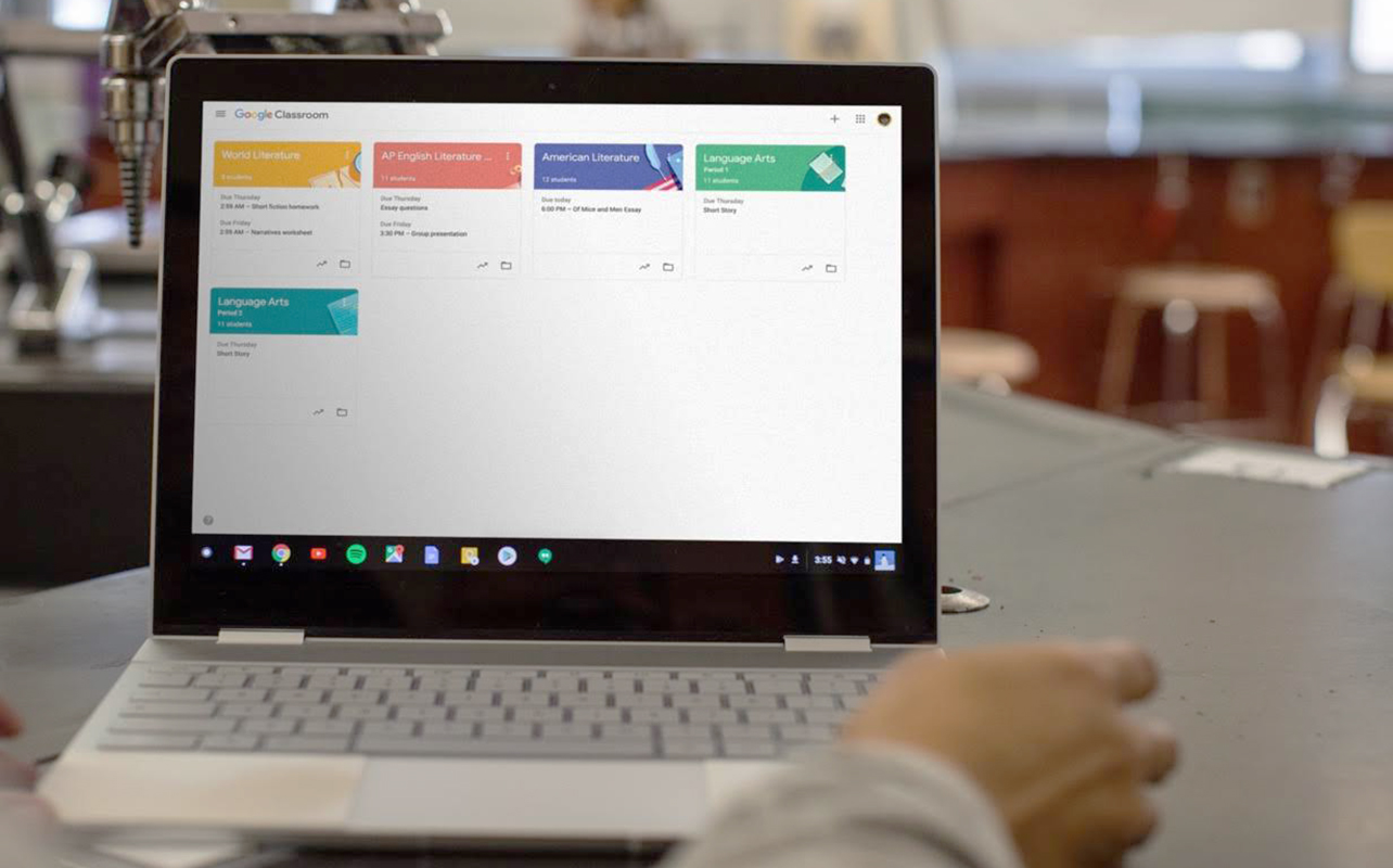 Google Classroom on a Chromebook sitting on a table in a classroom.