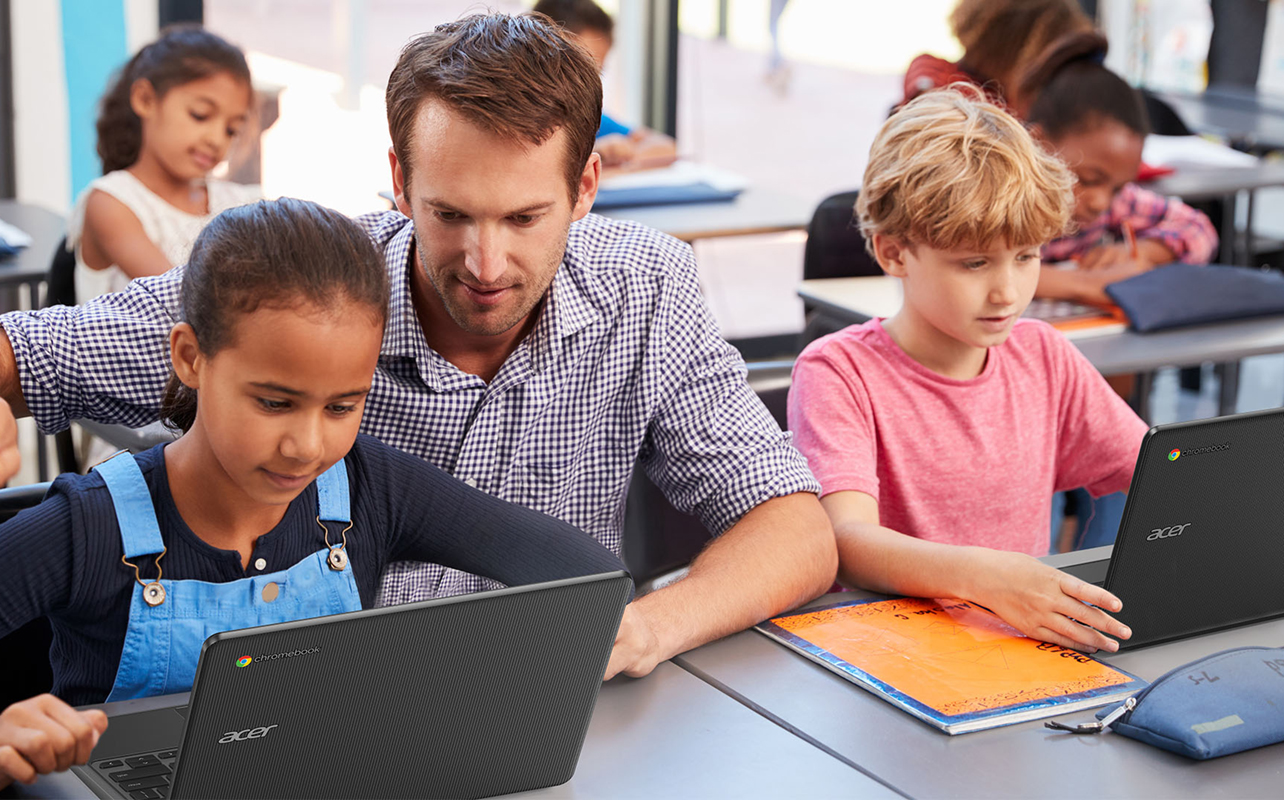 A teacher and students with Acer Chromebooks