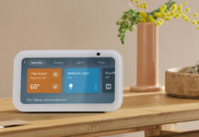 An Amazon Echo Show 5 on a side table showing smart home controls.