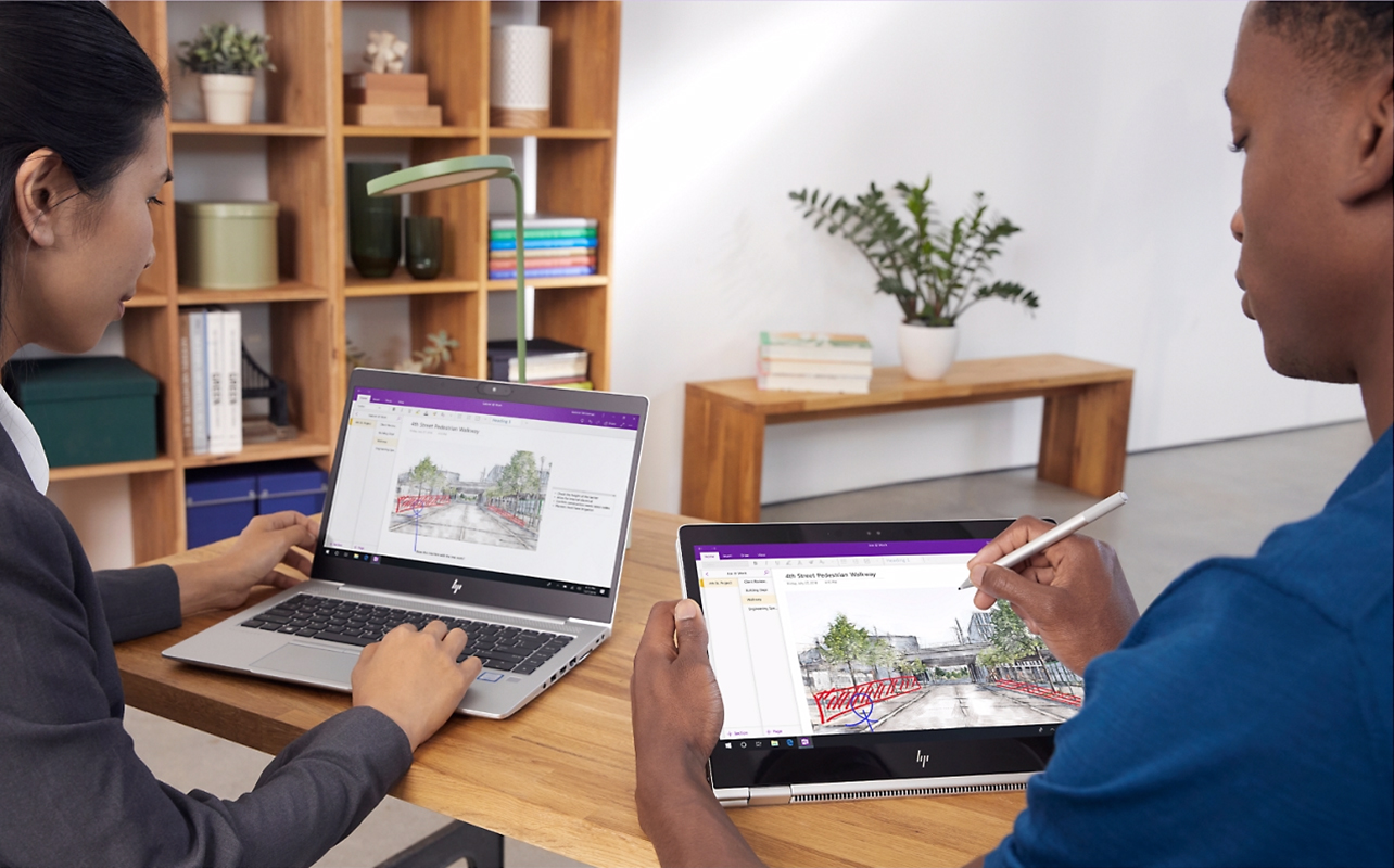 Two students using 2-in-1 laptops in different ways to work on the same project in Microsoft OneNote.