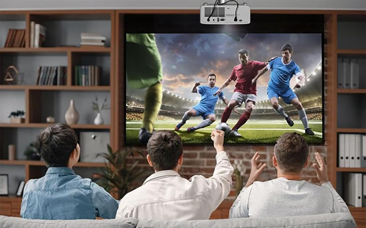 A group watching a soccer game using the Optoma GT2000 short-throw projector.
