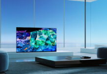 A QD OLED TV in a room with windows.