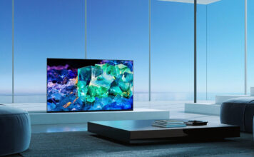 A QD OLED TV in a room with windows.