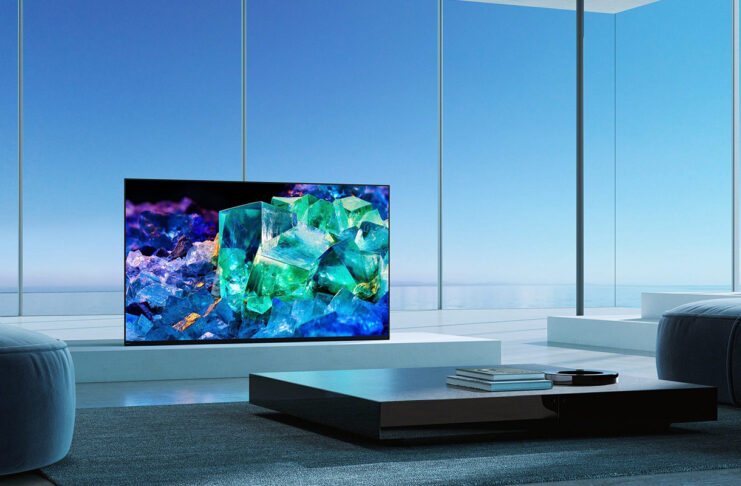A QD OLED TV in a room with windows.