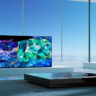 A QD OLED TV in a room with windows.