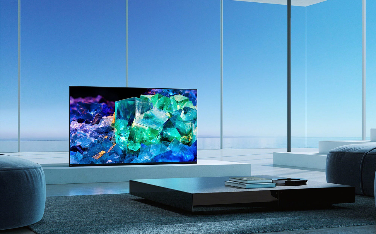 A QD OLED TV in a room with windows.