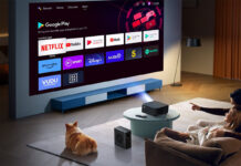 A family watching TV using the Yaber K2S projector.