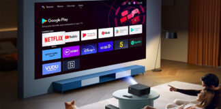 A family watching TV using the Yaber K2S projector.