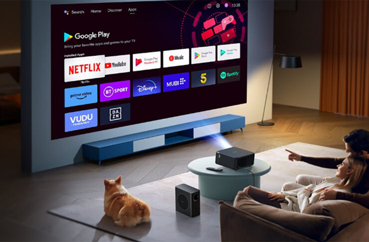 A family watching TV using the Yaber K2S projector.