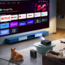 A family watching TV using the Yaber K2S projector.