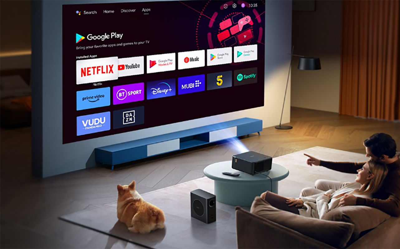 A couple watching TV using the Yaber K2S projector.