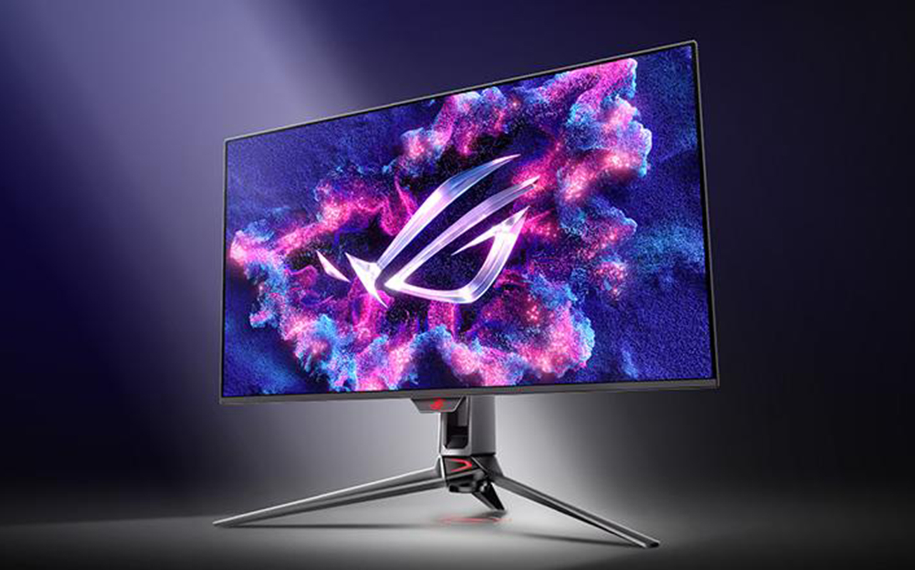 ASUS gaming monitor standing alone in front of monochrome background.