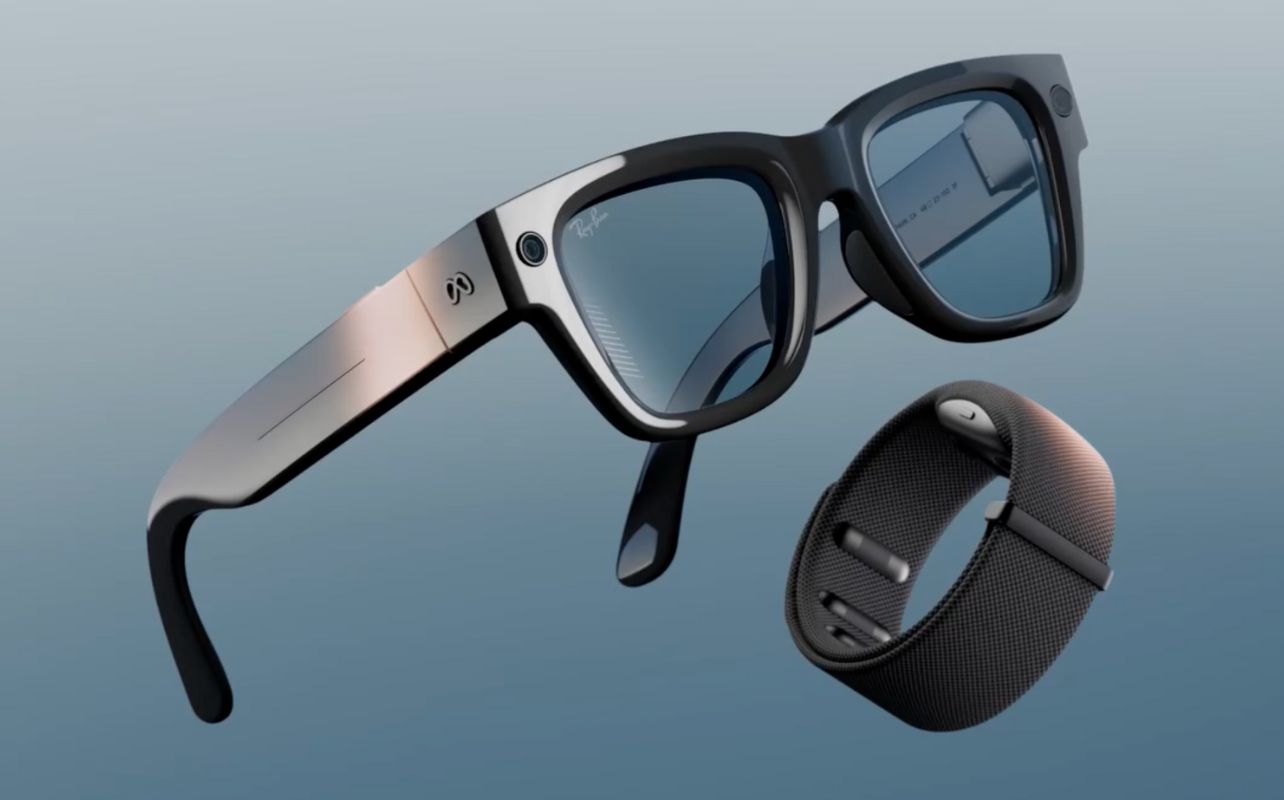 Sunglasses and a wristband float against a blue background.