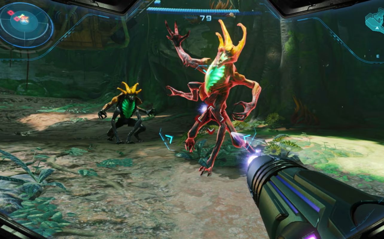 A vibrant alien, with glowing green and orange features, is attacked by a laser gun in a lush jungle setting. Heads-up display shows "79".