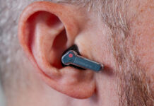 Close-up view of Nothing Ear (a) earbud in left ear.
