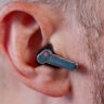 Close-up view of Nothing Ear (a) earbud in left ear.