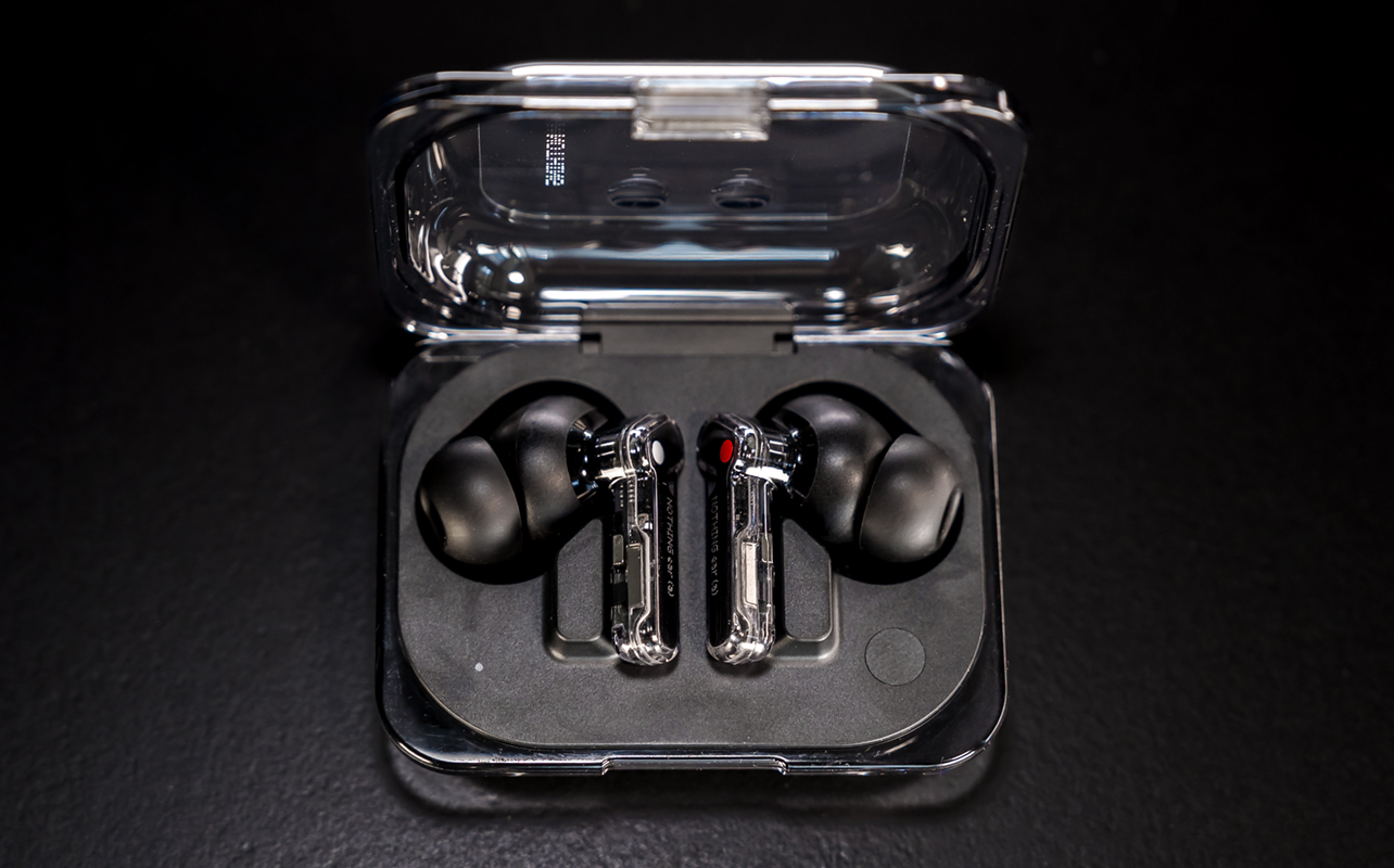 Nothing Ear (a) earbuds resting in charging case.