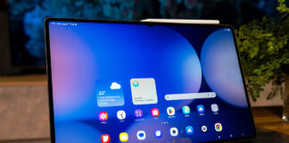 Samsung Galaxy Tab S11 Ultra sitting upright on a coffee table.