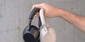 Holding the Sony WH-1000XM6 and XM5 in hand.