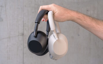Holding the Sony WH-1000XM6 and XM5 in hand.