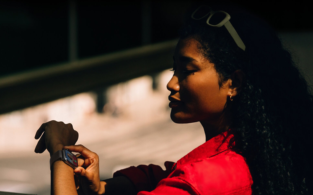 A woman wearing an Apple Watch Series 11