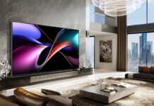 The Hisense 166UX on a wall in a living room.
