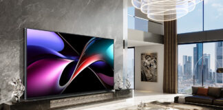The Hisense 166UX on a wall in a living room.