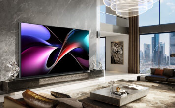 The Hisense 166UX on a wall in a living room.