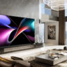 The Hisense 166UX on a wall in a living room.
