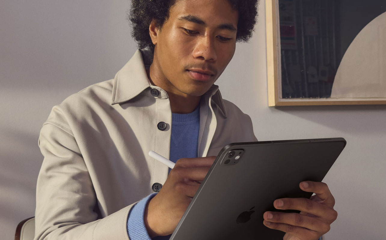 Man using Apple Pencil on an iPad Pro