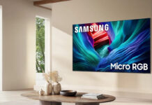A Samsung RGB TV on a wall in a living room.