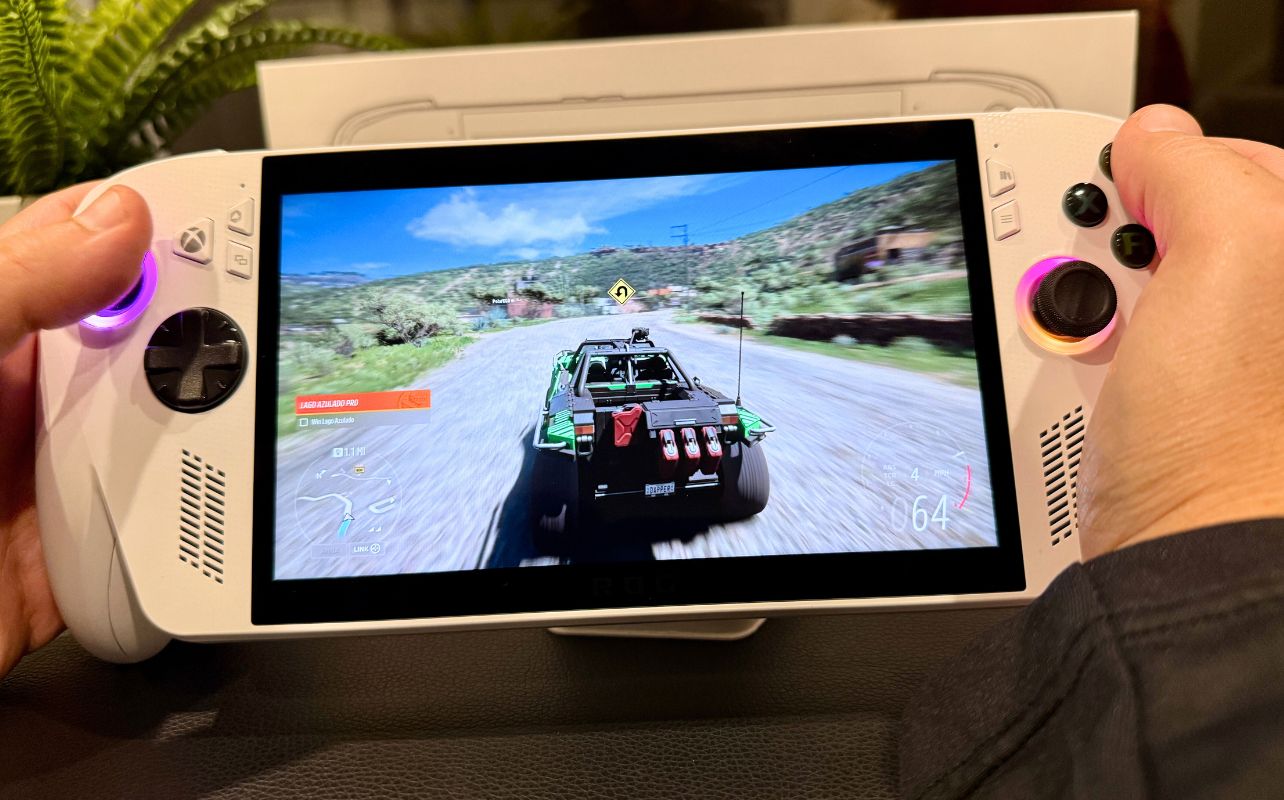 A racing game with vivid colours is being played on the ROG Xbox Ally X white shell console.