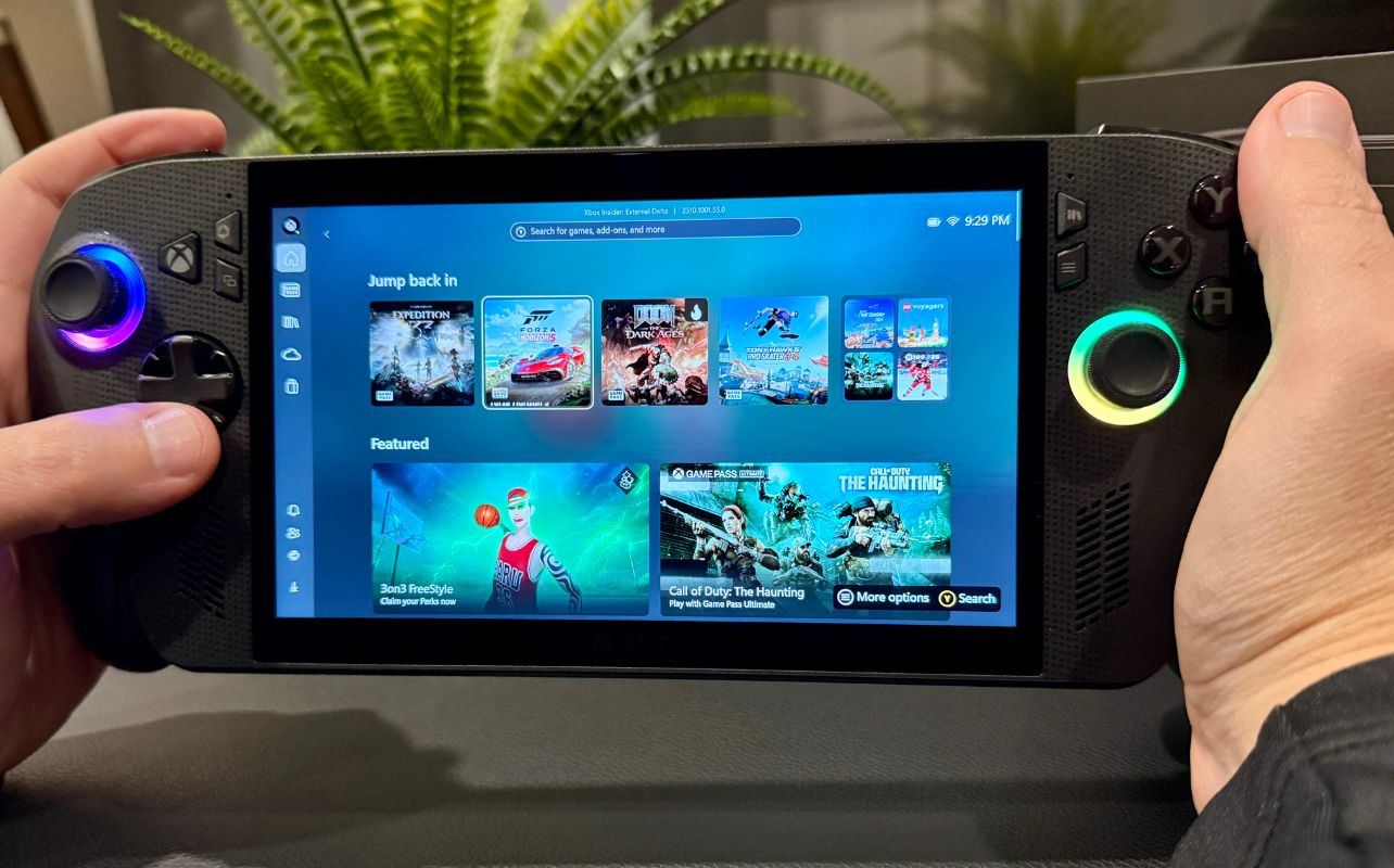 ASUS ROG Xbox Ally X with screen displaying different game artwork.