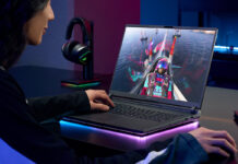 Woman playing video games on a gaming laptop.