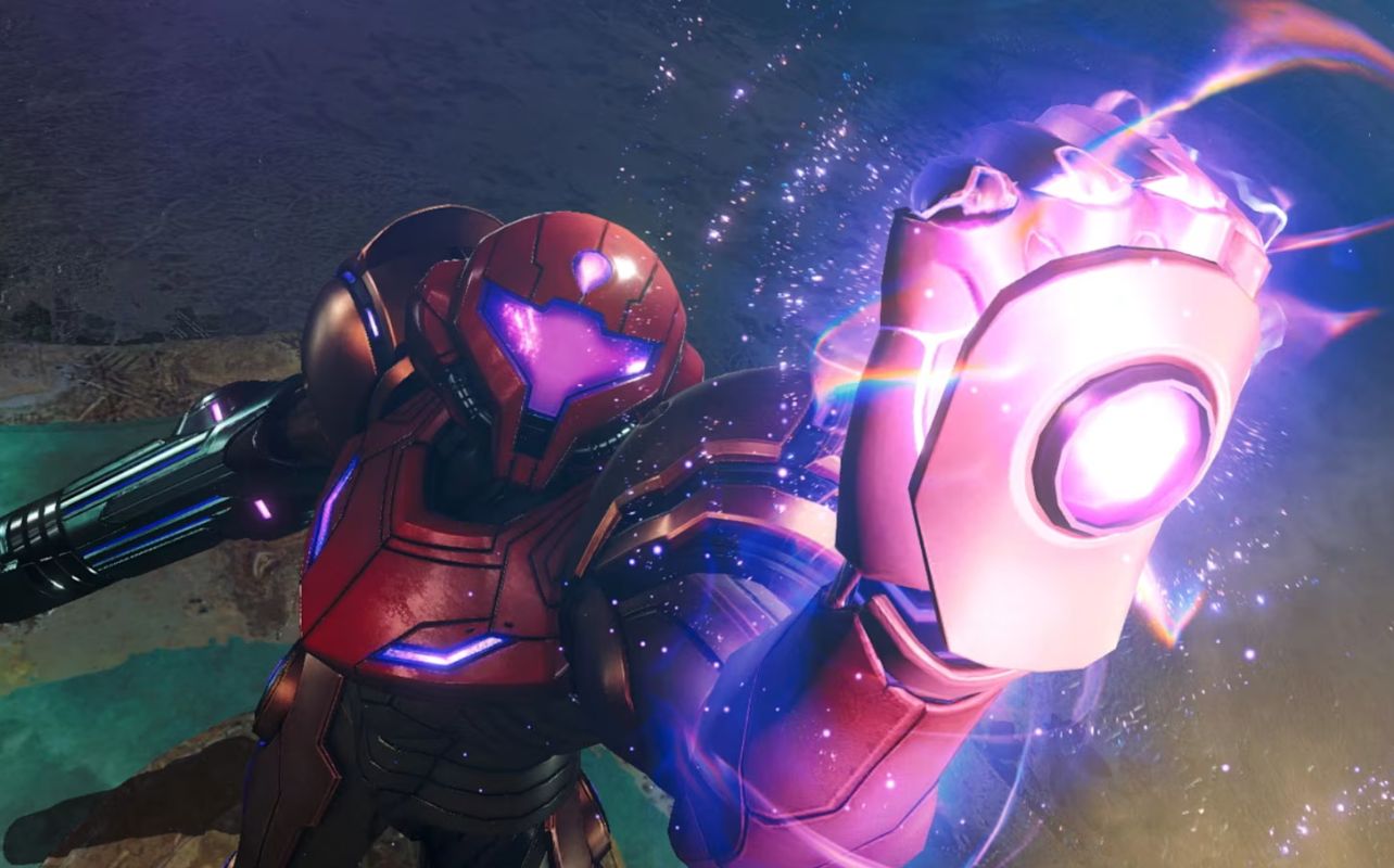 Red-armoured figure with glowing purple visor raises a fist, emitting bright energy. Background is dark with shimmering light effects. Futuristic mood.